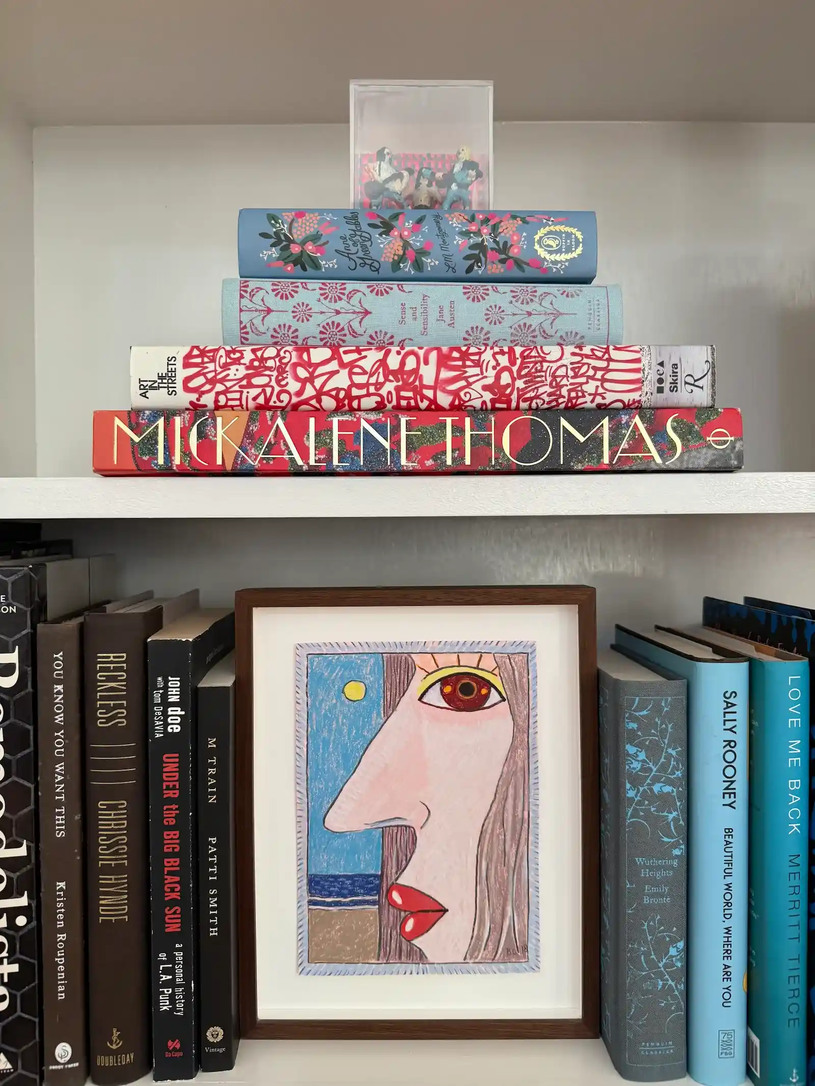drawing and books on shelves