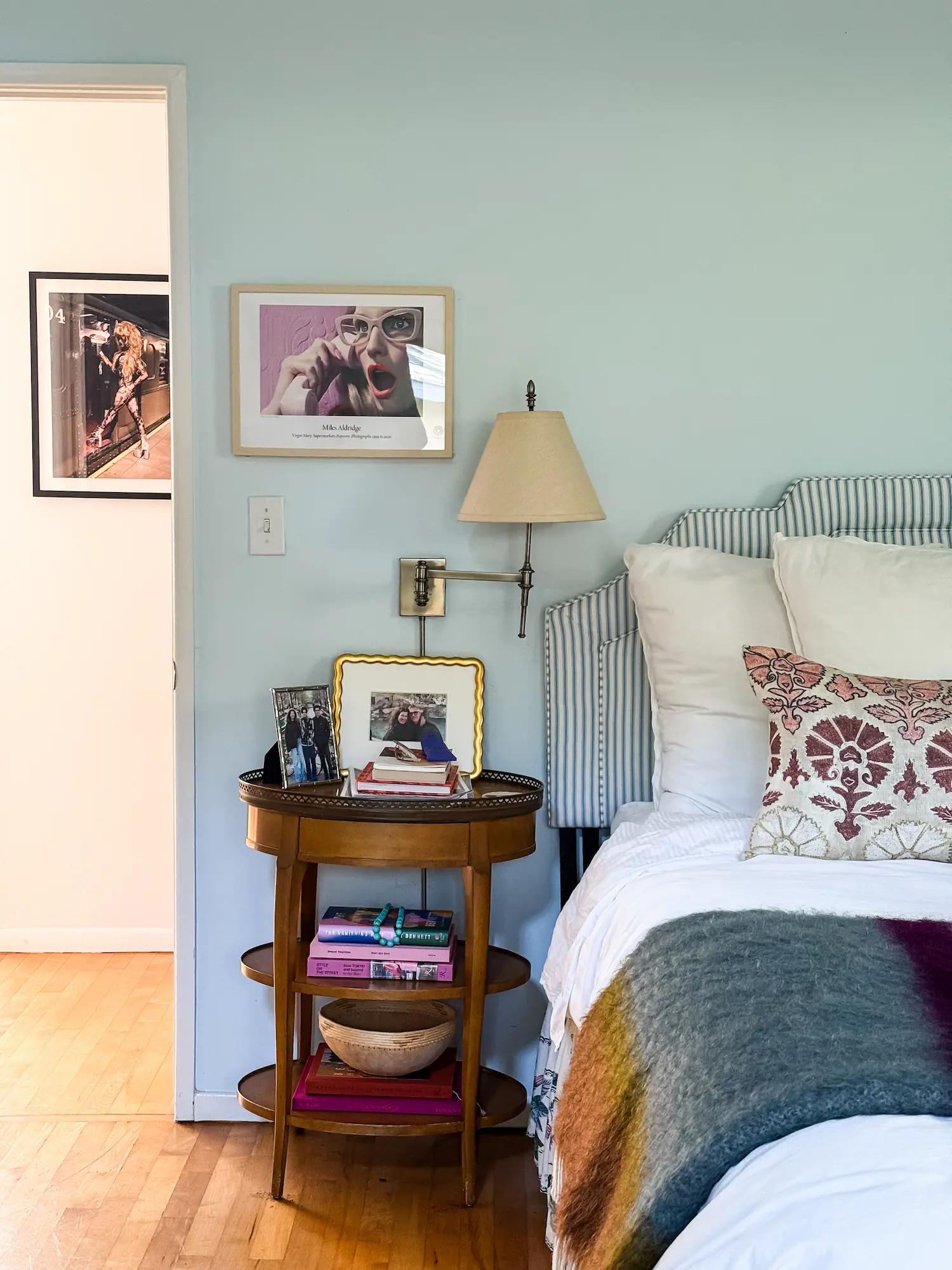 Bedroom with layered textiles and artwork