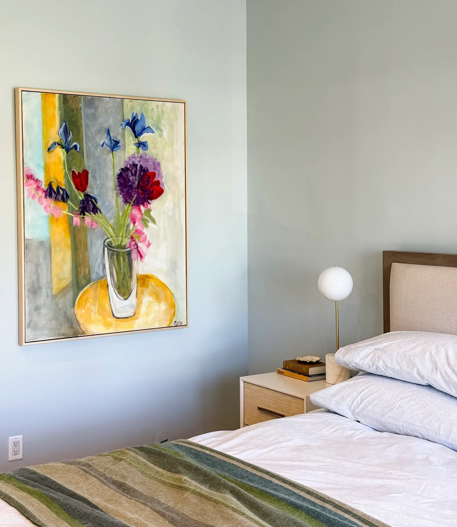 bedroom with painting