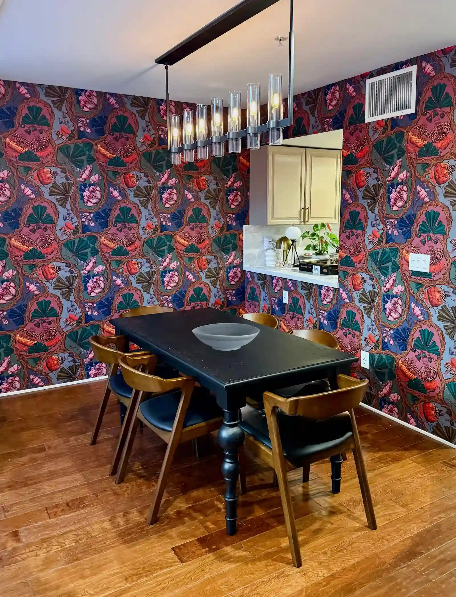 Dining room with floral wallpaper