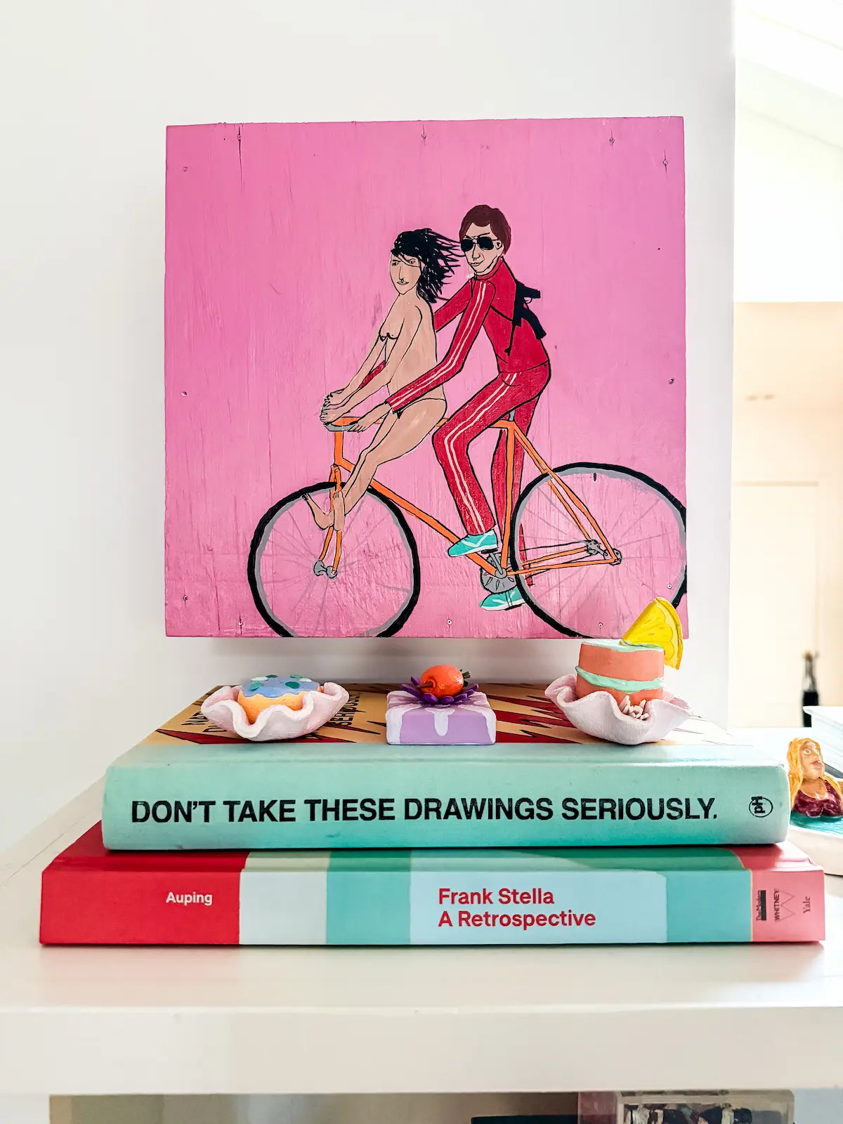 pink painting and books